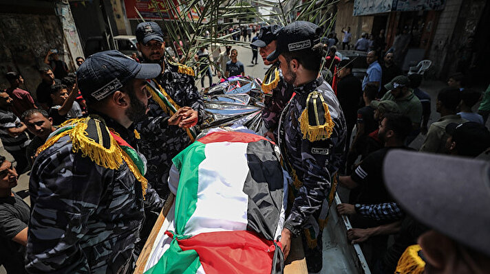 People carry the bodies of Selame Macid en-Nedim and Ala Ziyad al-Garabili, police officers who were killed on a blast targeting police checkpoints in Gaza, during his funeralceremony held at the Al-Amri Mosque in Gaza City, Gaza on August 28, 2019. Three Palestinian police officers were killed and several others wounded late Tuesday in two blasts in Gaza City, according to the Palestinian Interior Ministry.
