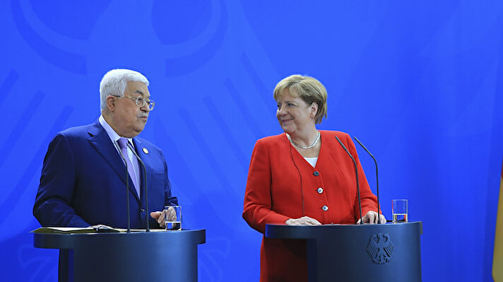 Palestinian President Mahmoud Abbas (L) and German Chancellor Angela Merkel (R) address a statement before talks at the Chancellery in Berlin, Germany on August 29, 2019.
