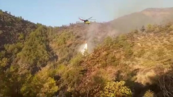 Marmaris Yalancıboğaz mevkiinde dün öğlen saat 12.36’da çıkan orman yangınında 14 helikopter ve 8 uçakla havadan, onlarca orman yangın söndürme aracı, belediyelerin itfaiye araçları ve yaklaşık bin kişilik personelle karadan müdahale ile yangın kontrol altına alındı. 
