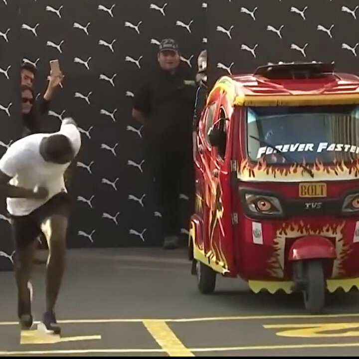 Usain Bolt gösteri yarışında triportöre büyük fark attı