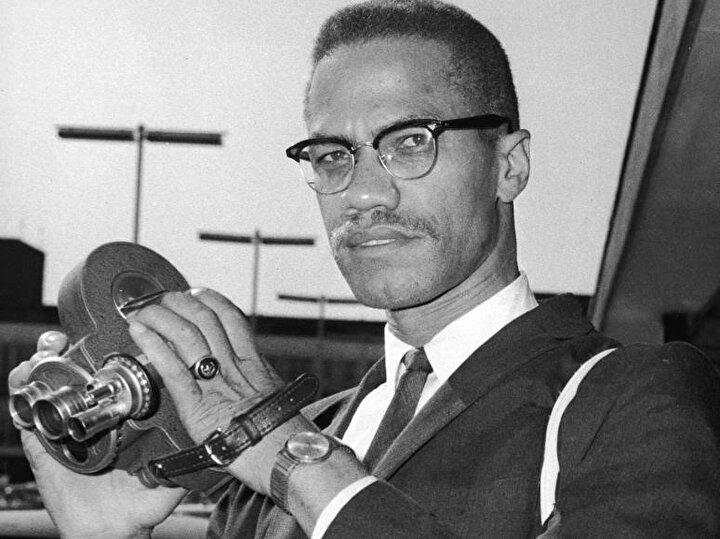 Malcolm X, film kamerasıyla Londra'da 1964.