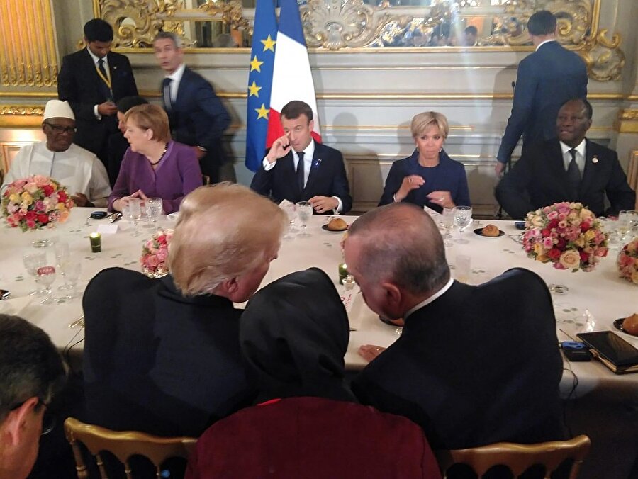 Dün Paris'te liderler onuruna verilen yemekte Erdoğan ve Trump kısa bir görüşme yapmıştı.
