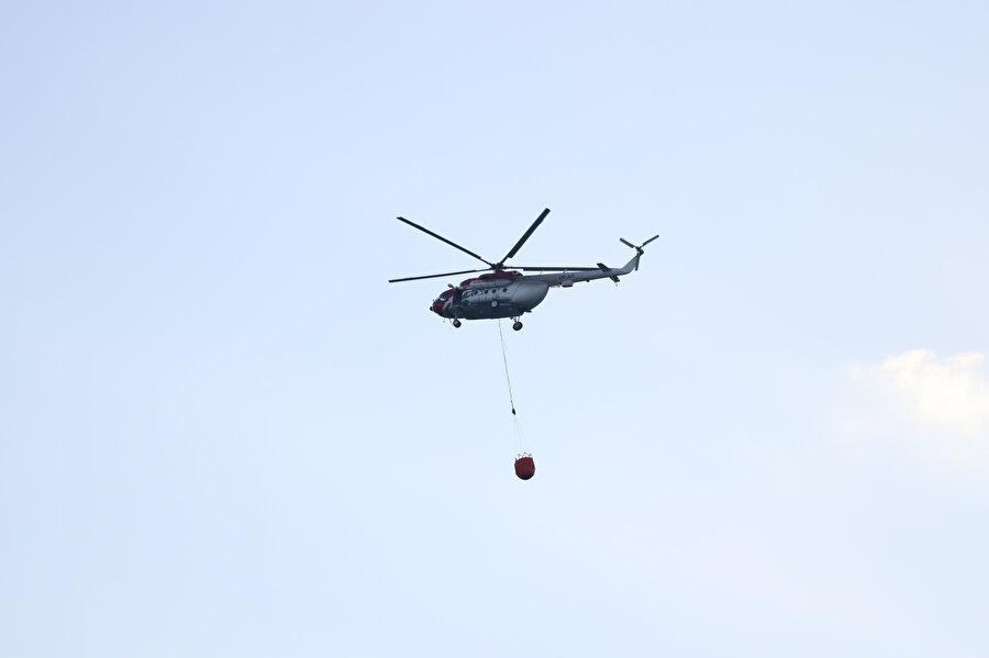 Yangın helikopterlerden de destek alınarak 10 saatte kontrol altına alındı. -AA