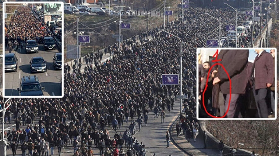 Ermenistan'da, Dağlık Karabağ savaşında ölen askerler anılırken, şemsiyelere gizli silahlar dikkat çekti