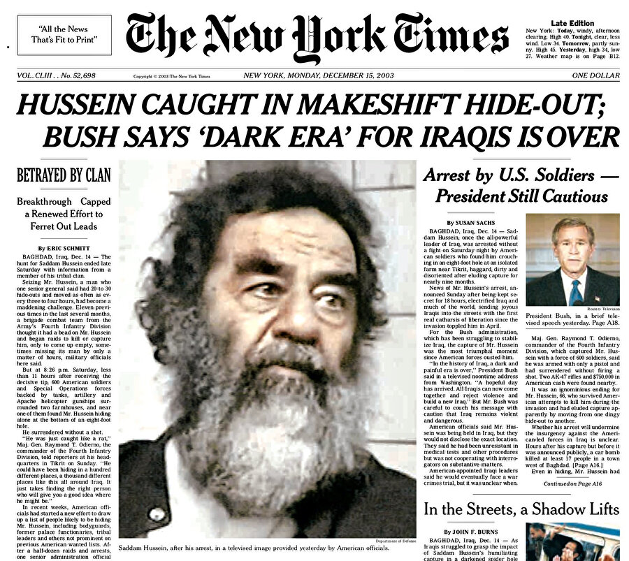 15 Aralık 2003 tarihli The New York Times gazetesinin manşeti: "Saddam Hüseyin derme çatma sığınakta yakalandı; Bush, Iraklılar için 'karanlık çağın' bittiğini söyledi."