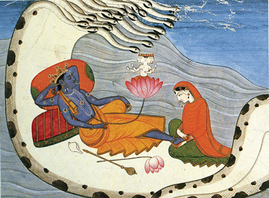 Hinduizmde Nihai Gerçek olarak nitelendirilen Tanrı Vişnu sonsuzluk yılanının koynunda uyurken göbeğinden bir nilüfer çiçeği çıkarak içinden Yaratıcı Tanrı Brahma beliriyor.