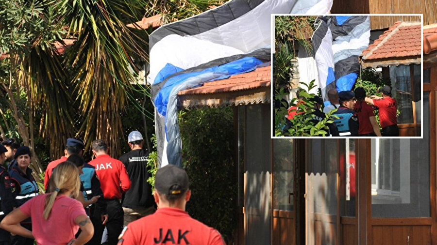 İsviçreli paraşütçü karakol binasının çatısına düştü.