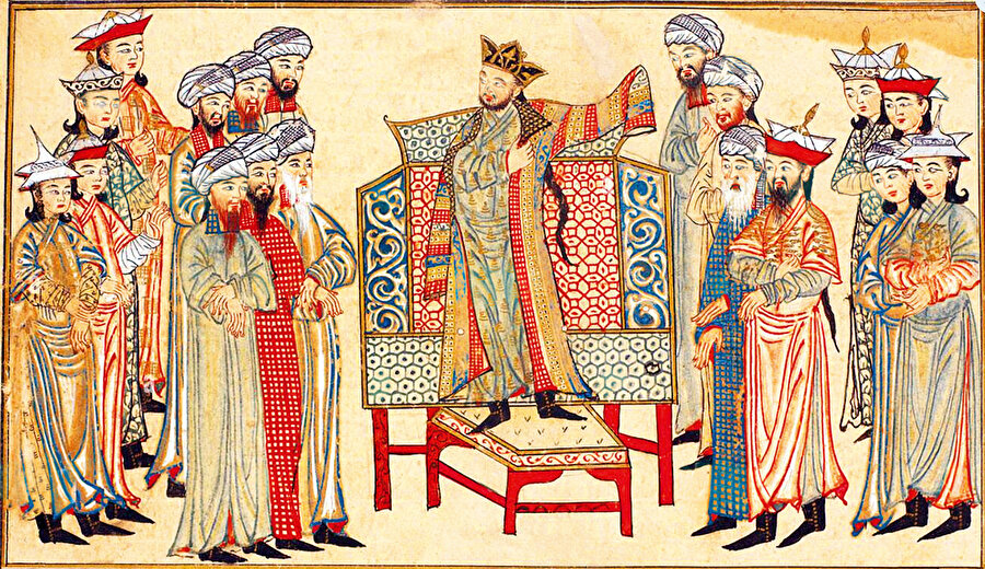 Hindistan Fatihi Gazneli Mahmud, Halife’nin gönderdiği hil’atı giyiniyor.