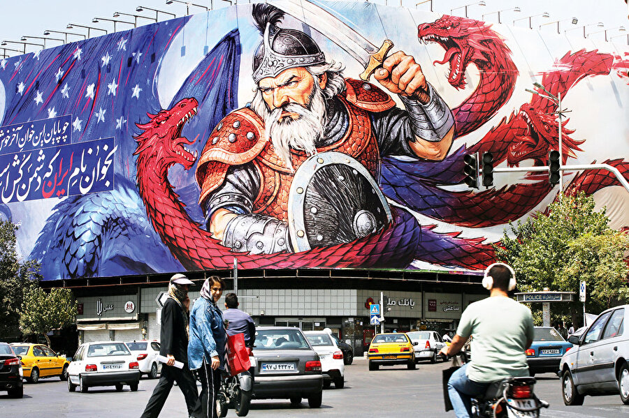 İran’ın başkenti Tahran’daki İnkılap Meydanı'nda Amerika'yı simgeleyen bir ejderhayla savaşan İran mitolojik kahramanı Rüstem'i tasvir eden dev afiş asıldı.