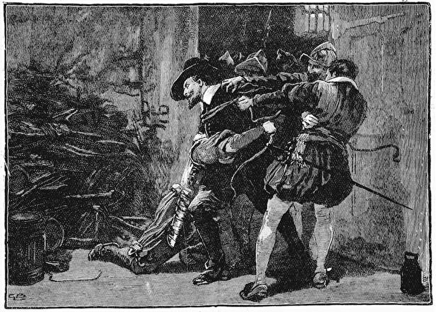 5 Kasım 1605 sabahı Guy Fawkes ve diğer komplocular için sonun başlangıcı oldu

                                    
                                    
                                    
                                    Parlamento binasını havaya uçurmak için önce meclis binasının altındaki mahzen kiralandı, buraya barut fıçıları yerleştirildi.

  


  
Yapılan korkunç plan sorunsuz bir şekilde işlerken,, komploculardan birisinin yaptığı bir hata suikast planını deşifre etti. Bu komplocu, sarayda çalışan bir akrabasına "o gün saraya gitmemesi" telkininde bulununca, Kral I. James her şeyi öğrendi ve 5 Kasım 1605 sabahı, Guy Fawkes barut fıçılarıyla mahsende yakalandı. Guy Fawkes, o andan itibaren İngiltere tarihinin en büyük vatan haini ilan edildi.

  


  
5 Kasım’da tutuklanan Fawkes, aylar boyunca işkence gördü ve bu komploda ona yardım edenlerin isimlerini vermeye zorlandı. En sonunda ‘vatan haini’ olarak hüküm giyen Fawkes, mahkeme kararıyla 31 Ocak 1606’da idam edildi
                                
                                
                                
                                