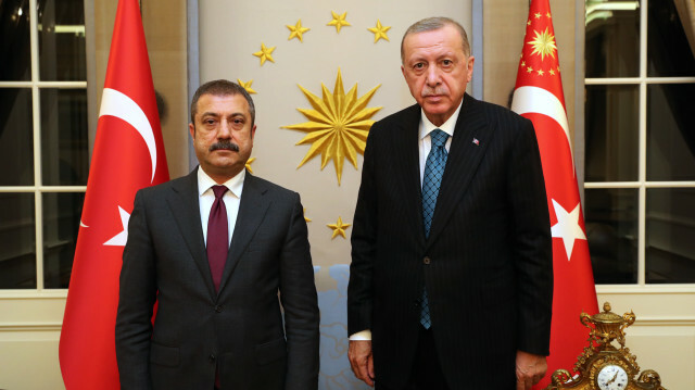 Turkish President Recep Tayyip Erdogan (R) poses for a photo with Chief of Turkey's Central Bank, Sahap Kavcioglu (L) prior to their meeting in Ankara, Turkey on October 13, 2021. 