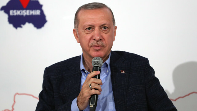 Turkish President Recep Tayyip Erdogan answers the question of women attending the event at Anadolu University Turkish World Science Culture and Art Center in Eskisehir, Turkey on October 23, 2021.