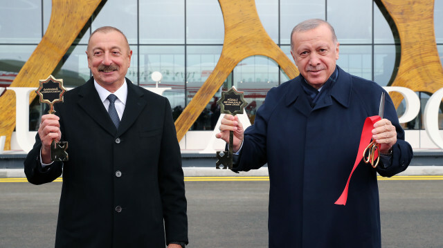 Turkish President Recep Tayyip Erdogan is welcomed by Azerbaijani President Ilham Aliyev upon his arrival at Fuzuli International Airport, the first airport built by Azerbaijan in the area recently liberated from Armenian occupation in Fuzuli, Azerbaijan on October 26, 2021.