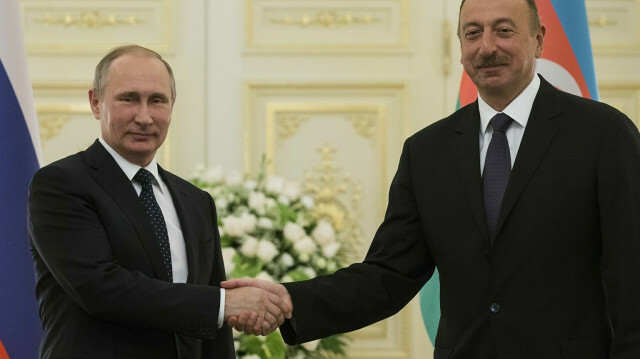 Russian President Vladimir Putin shakes hands with Azerbaijani counterpart Ilham Aliyev