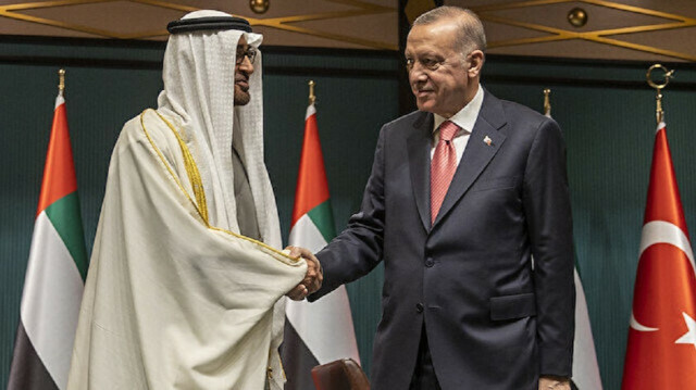 Turkish President Recep Tayyip Erdogan shakes hands with Emirati Crown Prince Sheikh Mohammed bin Zayed bin Sultan Al Nahyan