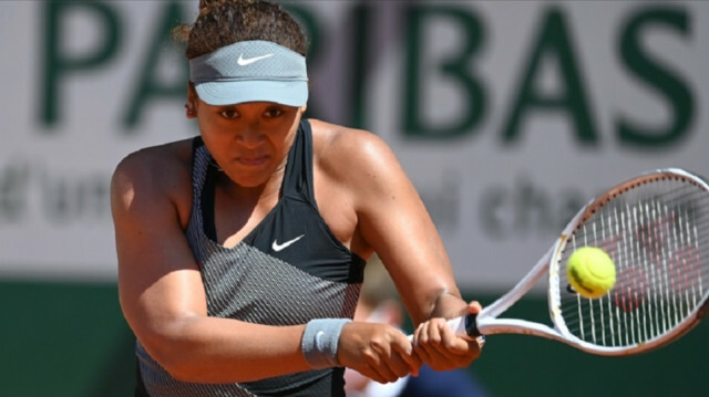 Naomi Osaka of Japan in action against Patricia Maria Tig (not seen) of Romania in the first round of the women singles during the French Open Tennis Tournament at Roland Garros in Paris, France on May 30, 2021. ( Mustafa Yalçın - Anadolu Agency )