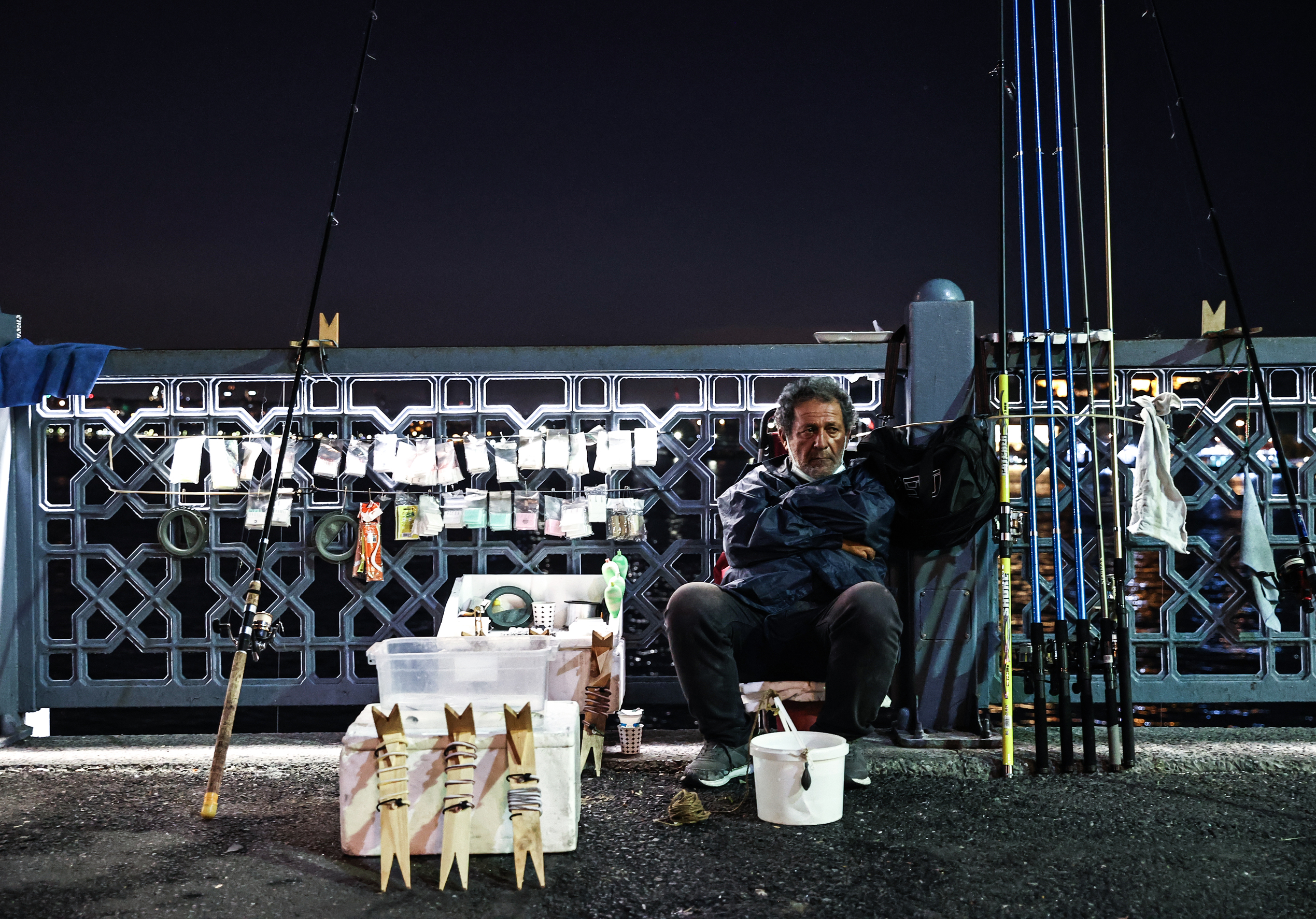 Fishermen catch fish at Galata Bridge in Istanbul