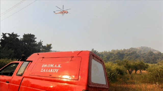 Helicopters battle against the forest fires in the isle of Rodos, Dodecanese, Greece on August 02, 2021. ( LEFTERIS DAMIANIDIS - Anadolu Agency )