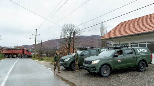 NATO mission in Kosovo (KFOR), inspect two new roadblocks set up by local Serbs in Mitrovica, Kosovo, on December 15, 2022.