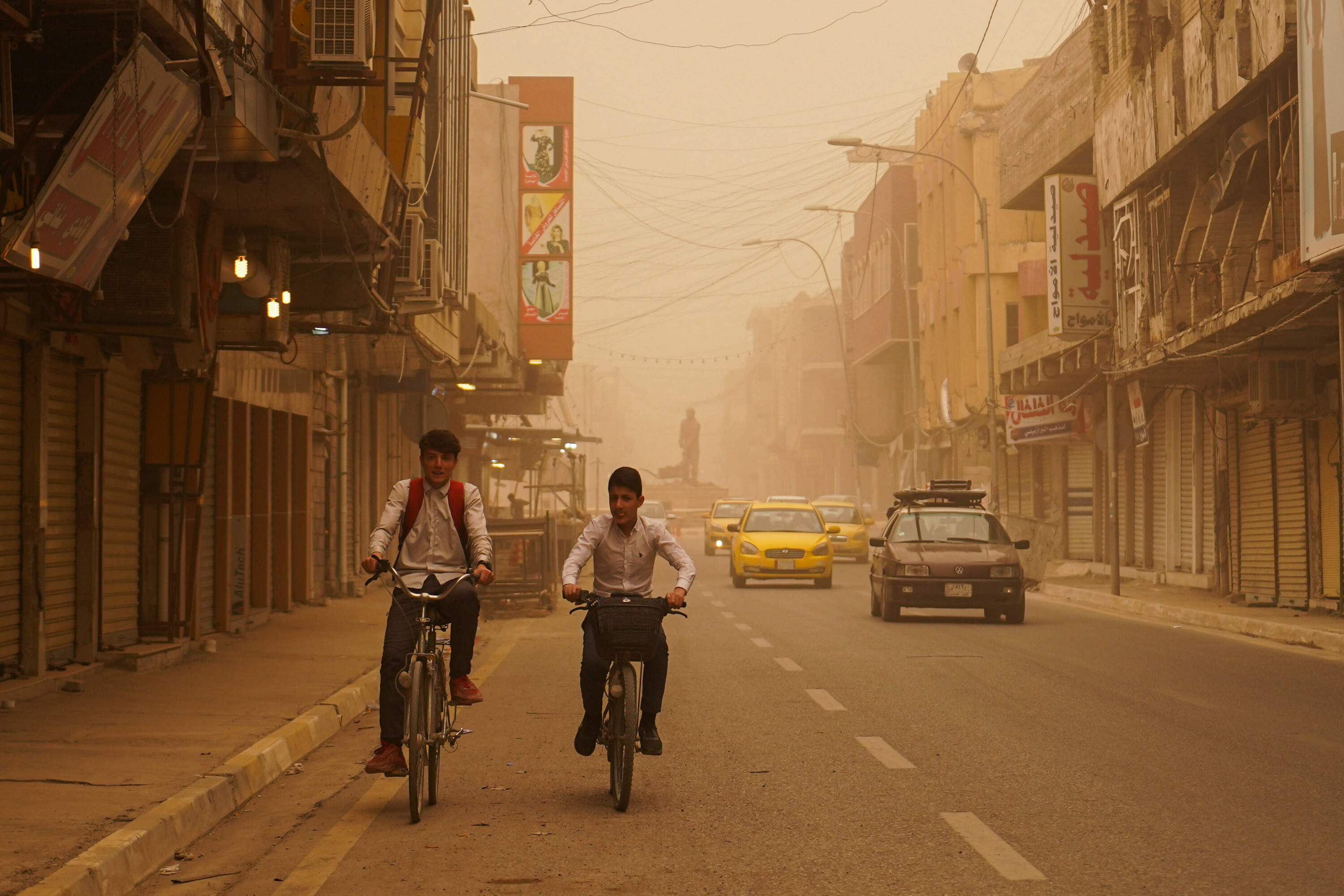 Mosul lake covered in orange haze as sandstorm batters Iraq