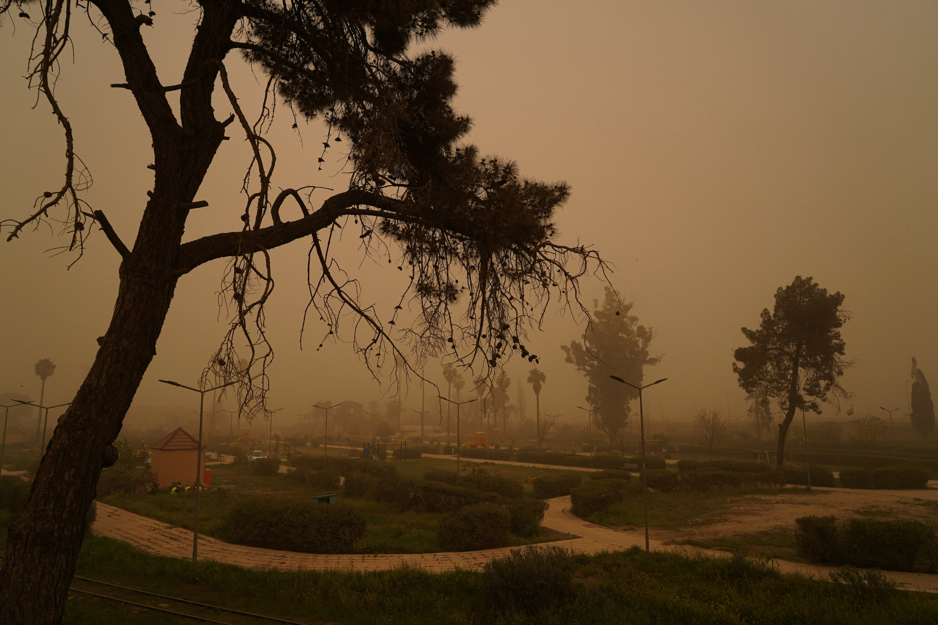 Mosul lake covered in orange haze as sandstorm batters Iraq