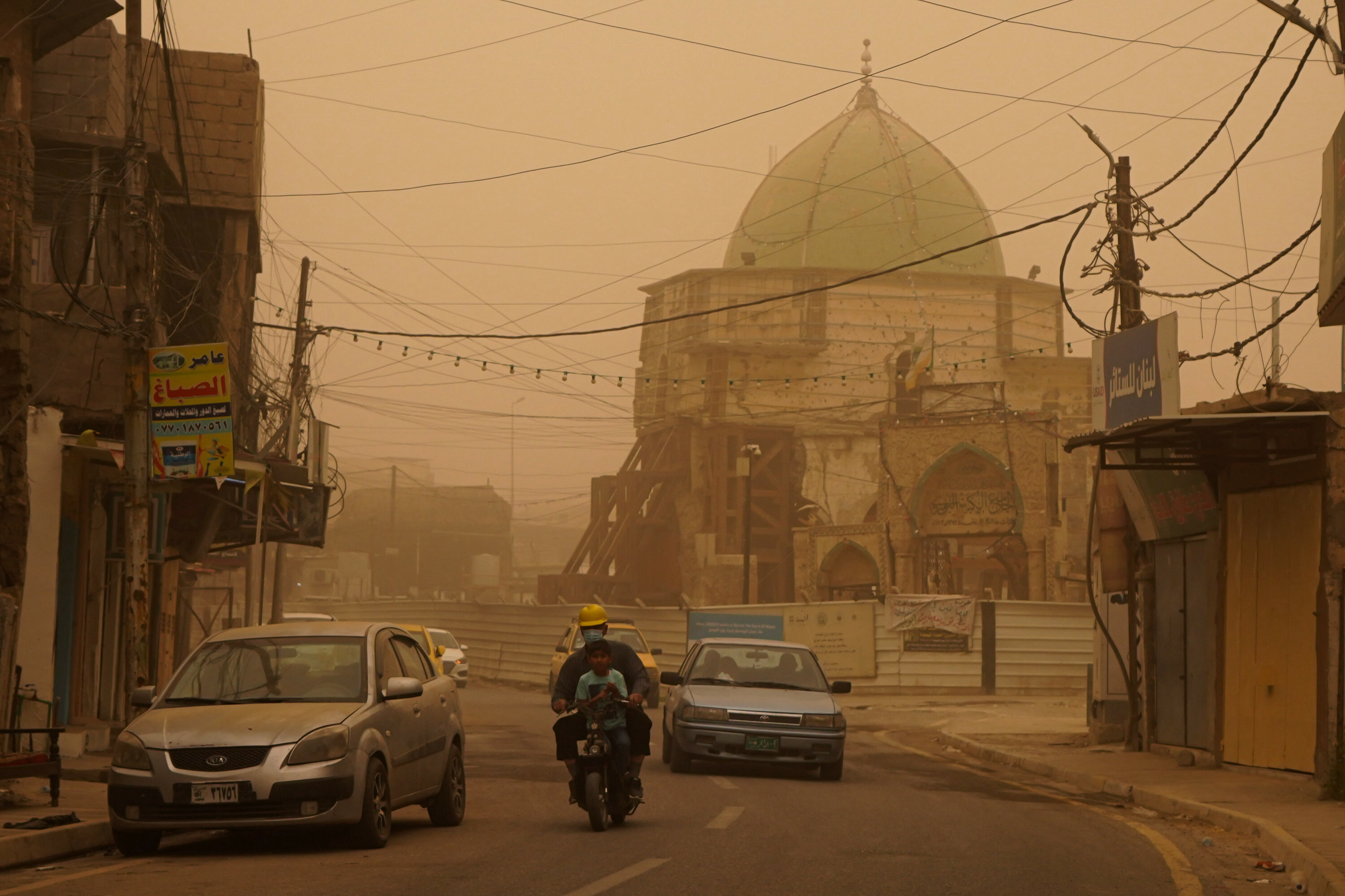 Mosul lake covered in orange haze as sandstorm batters Iraq
