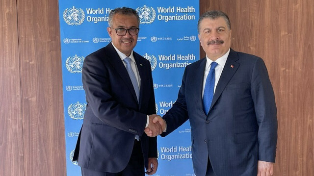 WHO Director-General Tedros Adhanom Ghebreyesu and Turkish health minister 
Fahrettin Koca 