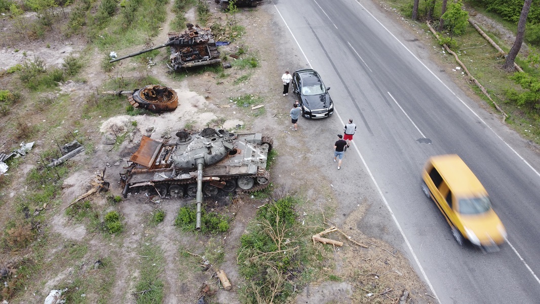 Ukrainians show interest in destroyed military vehicles outside Kyiv