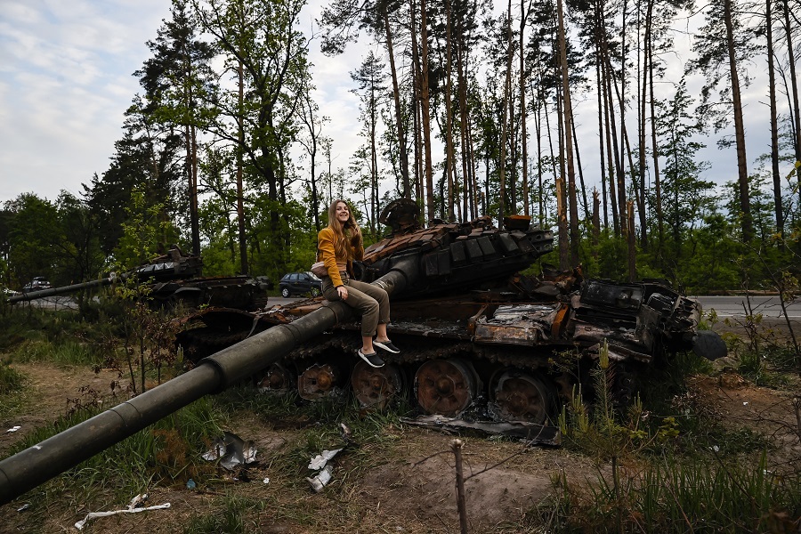 Ukrainians show interest in destroyed military vehicles outside Kyiv