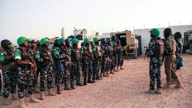 Des policiers de la mission de maintien de la paix de l'Union africaine en Somalie (AMISOM) de l'Ouganda, du Kenya, de la Sierra Leone, du Nigeria, du Ghana et de la Zambie. Crédit photo: Tina SMOLE / AFP