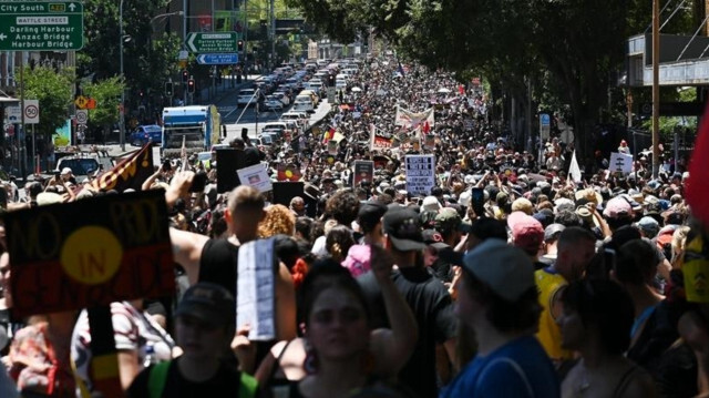 People participate in an ‘Invasion Day’ protest in Sydney, Australia, on January 26, 2023. Thousands of protesters have descended on city streets in solidarity with Indigenous Australians to commemorate Invasion Day.