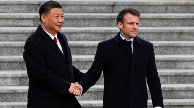 Les présidents chinois(G) et français (D), Xi jinping et Emmanuel Macron. Crédit Photo: NG Han Guan / POOL / AFP