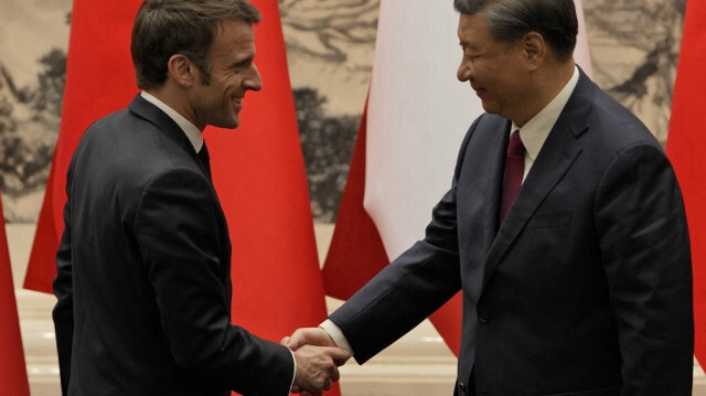 Les présidents français et chinois, Emmanuel Macron et Xi Jinping. Crédit Photo: Ng Han Guan / POOL / AFP