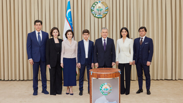 Uzbekistan President Shavkat Mirziyoyev and his family cast their votes during the constitutional referendum for amendments at a polling station in Tashkent, Uzbekistan on April 30, 2023.