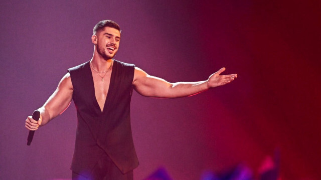 Le chanteur Andrew Lambrou qui a interprété la chanson chypriote grecque lors de la finale de l'Eurovision, le 13 mai 2023. Crédit Photo: Oli SCARFF / AFP