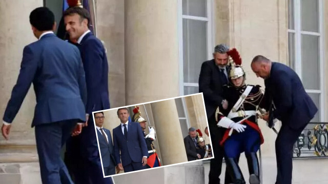 Yanındaki muhafız sıcaktan bayılırken Macron'un umursamaması Fransa'da gündem oldu.