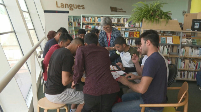 Des migrants trouvent "refuge" dans une bibliothèque de Rennes, en France. Crédit Photo: AGNES COUDURIER / AFPTV / AFP