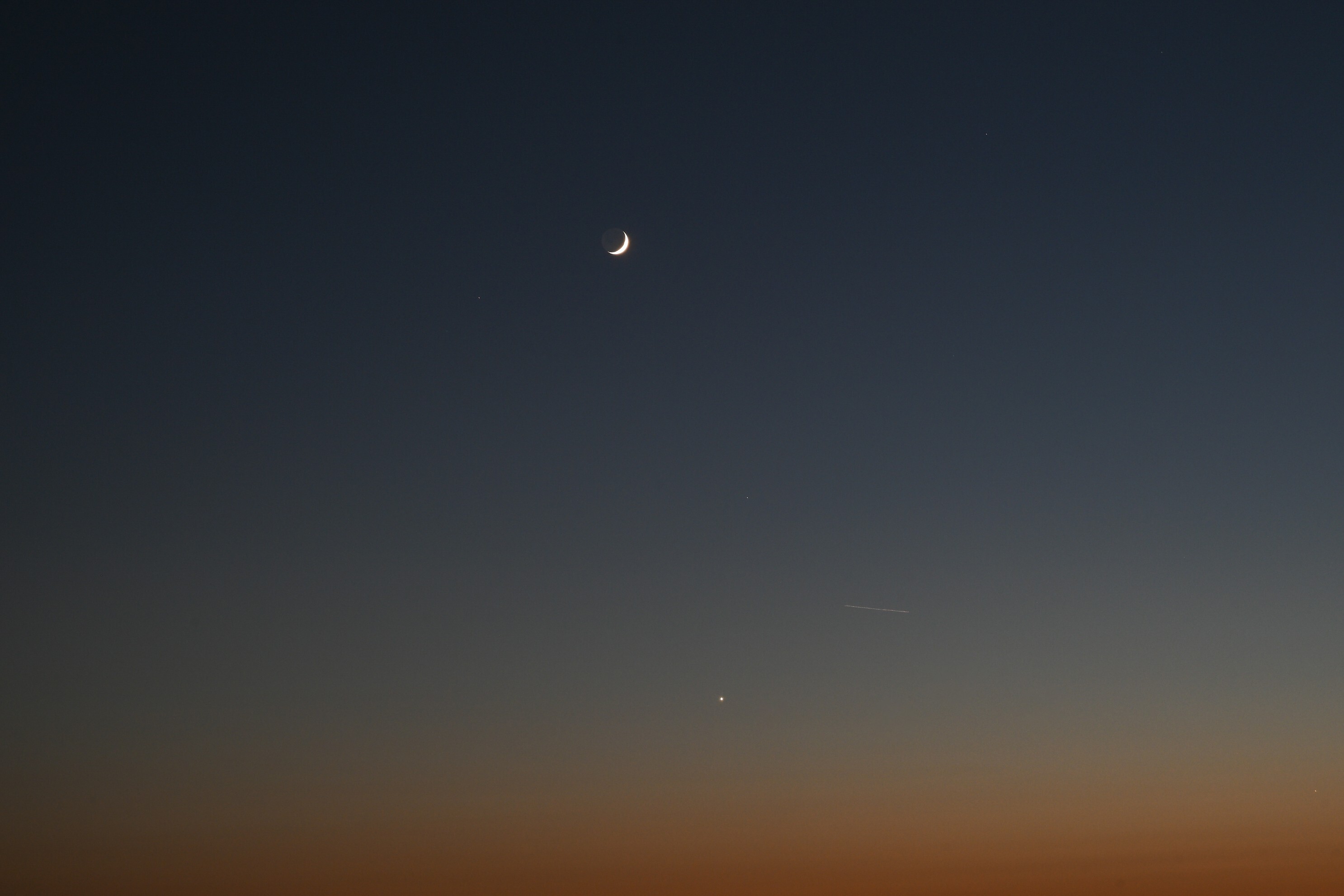 Crescent moon sets over the San Francisco Bay
