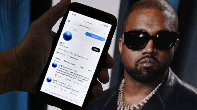Sur cette photo d'illustration, le compte Twitter de Kanye West est affiché sur un téléphone portable. Crédit photo: OLIVIER DOULIERY / AFP