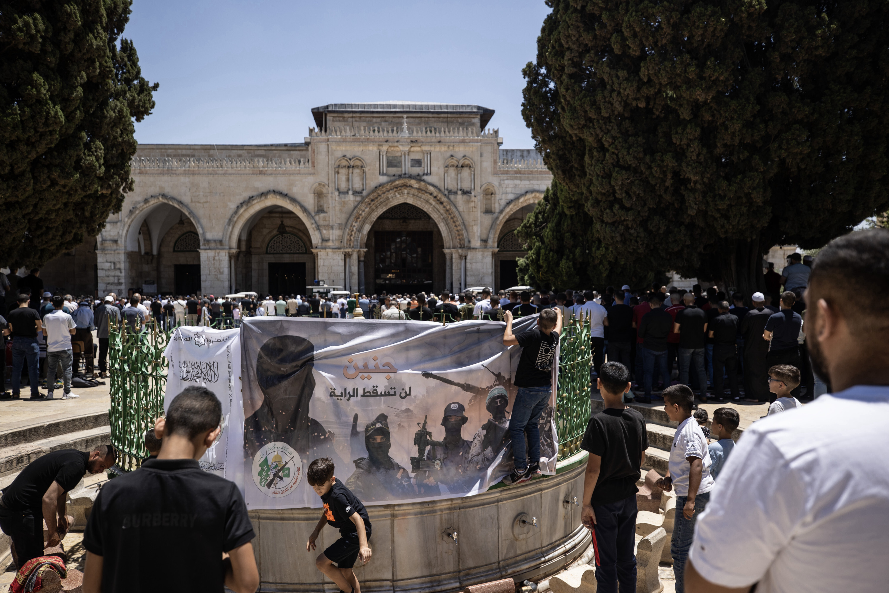 A poster exhibited in support of Jenin before Friday prayer at Aqsa Mosque