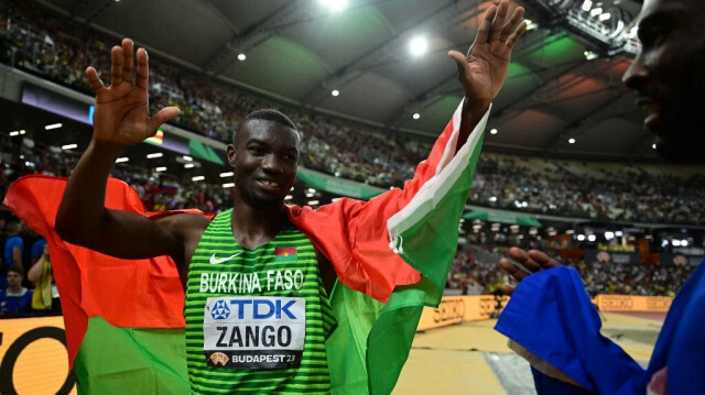 L'athlète burkinabé Hugues-Fabrice Zango, sacré Champion du Monde de Triple Saut à Budapest, le 21 août 2023. Crédit photo: Ben Stansall / AFP.