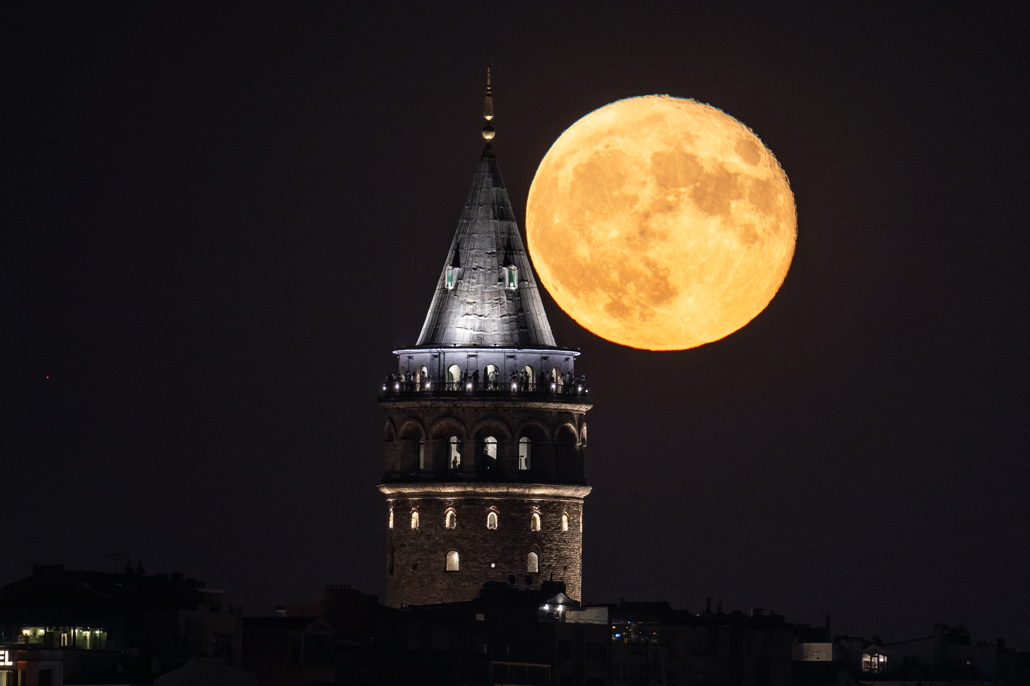 Full Moon rises over Galata Tower in Istanbul
