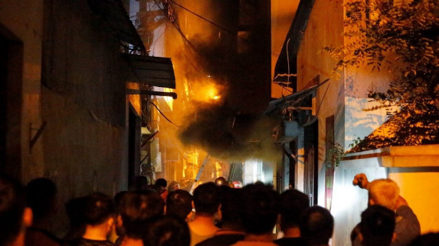 L'incendie dans l'immeuble d'habitation à Hanoi au Vietnam. Crédit photo: STR / AFP