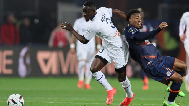 Le joueur de Football Eric Bailly, et l'ancien joueur de Montpellier Elye Wahi. Crédit Photo: PASCAL GUYOT / AFP.