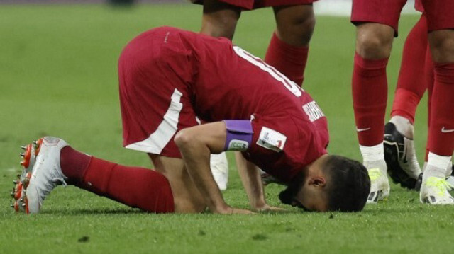 L'attaquant qatari Hassan Al-Haydos, célèbre son but lors du match de football du Groupe A de la Coupe d'Asie des nations 2023 entre le Qatar et la Chine, au stade Khalifa International à Doha le 22 janvier 2024. 