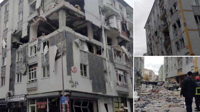 Ekipler, caddede büyük hasara yol açan patlama nedeniyle kurtarma çalışması yapıyor.