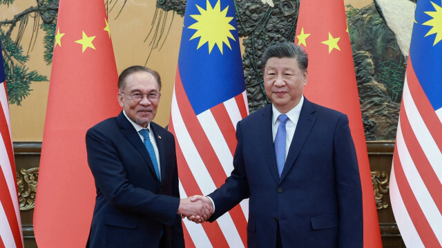 Le président chinois Xi Jinping et le Premier ministre malaisien Anwar Ibrahim.