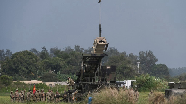 Des soldats se rassemblent à côté d'un système de missiles sol-air Patriot lors de l'exercice militaire conjoint américano-philippin Balikatan à San Antonio, dans la province de Zambales, au nord de Manille au Philippines.