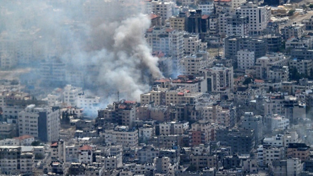 Fumée s'élevant dans la bande de Gaza, le 21 mars 2024.