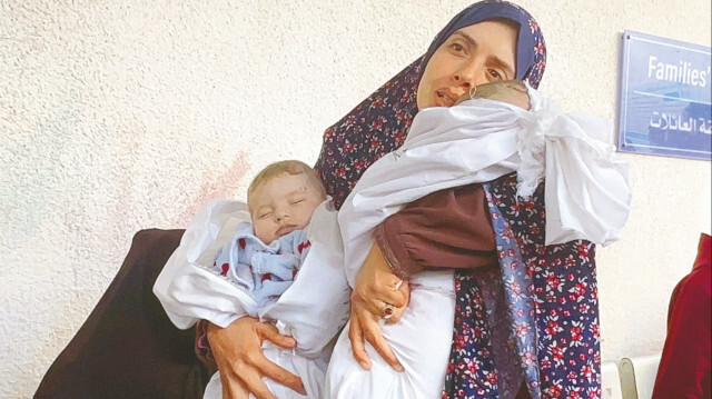 İsrail’in Refah’taki saldırılarında bu kez Ebu Anze ailesinin evi hedef oldu. Saldırıda eşi ve 4 aylık ikiz bebeklerini kaybeden Rana Ebu Anze büyük bir acı yaşadı. Rana Ebu Anze'nin 10 yıl bekledikten sonra tüp bebek tedavisiyle çocuk sahibi olduğu öğrenildi.
